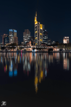 Commerzbank and Eiserner Steg mirrored in the Main river