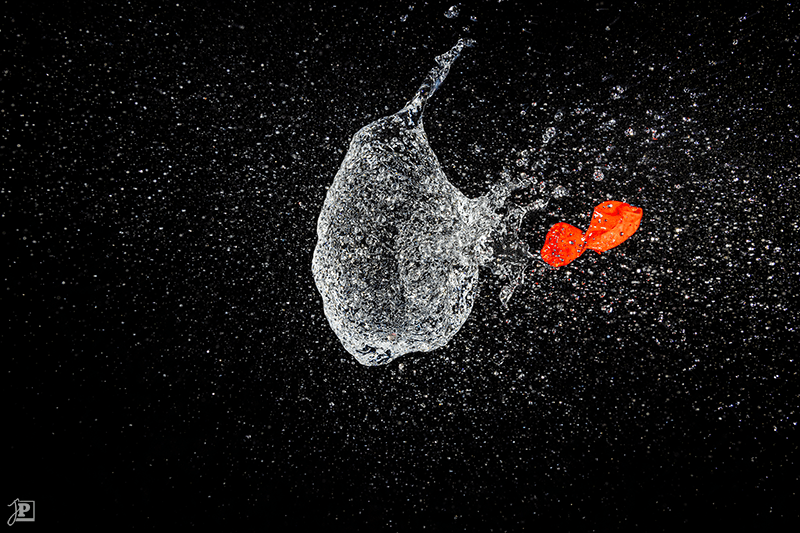 Bursting red water balloon