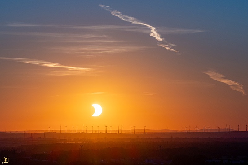 Sunset during a partial solar eclipse